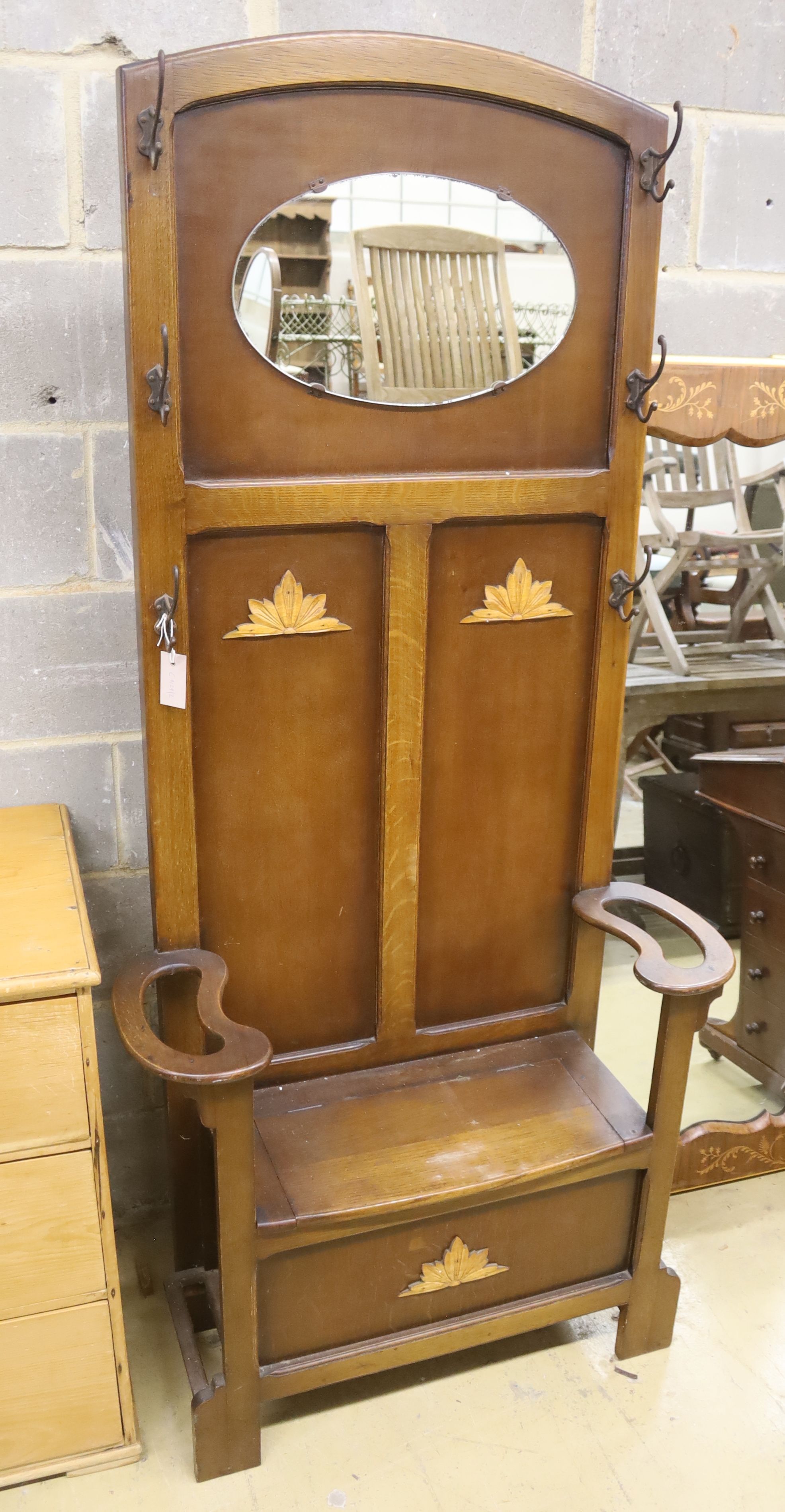 A 1930's oak hall stand, width 86cm, height 180cm